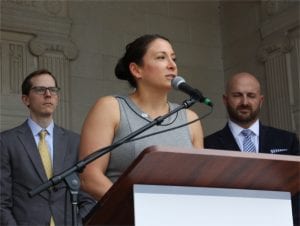 NJBIA Chief Government Affairs Officer Christine Buteas speaks at a press conference following the vote.