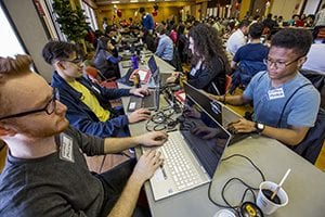 image of computer coders at Hackathon