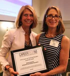 NJBIA's Michele Siekerka receives the CTE Leadership Award from Judy Savage, executive director of the New Jersey Council of County Vocational-Technical Schools