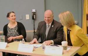 NJBIA Chief Government Affairs Officer Chrissy Buteas (left), Senate President Stephen Sweeney, NJBIA President and CEO Michele Siekerka at a table a
