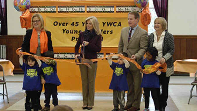 Dignitaries at ribbon cutting marking 45th anniversary of Young Wonders Child Development Center in Hamilton