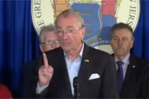 Gov. Phil Murphy gestures during a press conference on the budget.
