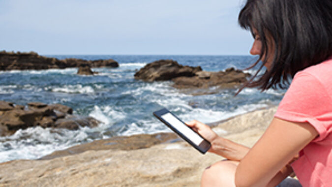 Woman reading on beach image