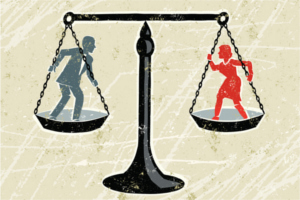 Drawing of man and woman on a balance scale