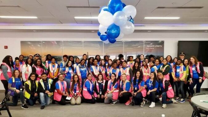Photo Caption: Young women from the Girl Scouts Heart of New Jersey, the Boys & Girls Club Newark and Boys & Girls Clubs of Union County gathered at Newark Liberty International Airport on October 5 in celebration of Girl’s in Aviation Day to learn from United Airline’s women employees.