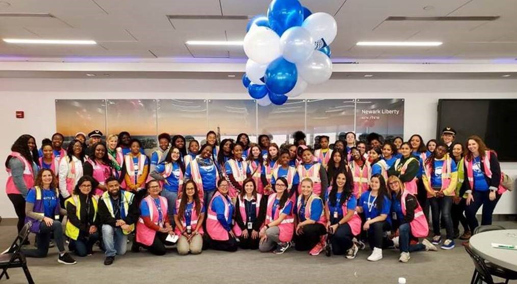 Photo Caption: Young women from the Girl Scouts Heart of New Jersey, the Boys & Girls Club Newark and Boys & Girls Clubs of Union County gathered at Newark Liberty International Airport on October 5 in celebration of Girl’s in Aviation Day to learn from United Airline’s women employees.