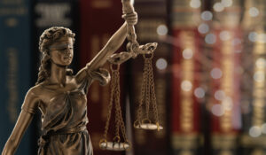 ustice law legal concept. statue of justice or lady justice with law books background.