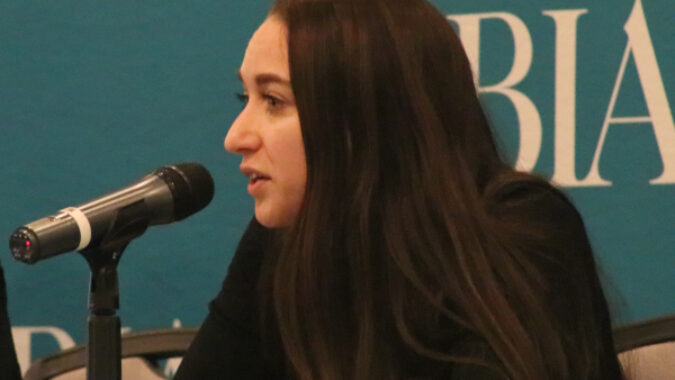 Ashley LeBrun of Archer Law responds to an audience question, speaking into a microphone during NJBIA's Leave Laws 3.0 seminar.