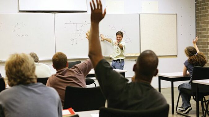 Teacher calling on a student in a classroom