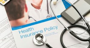 Healthcare policy booklet and stethoscope