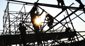 Silhouette of construction workers outside