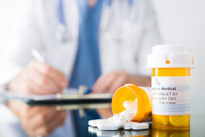 Image of pill bottles and Rx pad