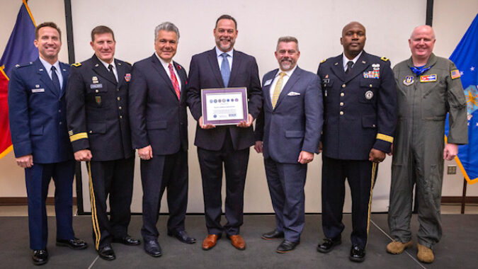 Miguel Palmero, center, Executive Officer, Royal Caribbean International, holds the Employer Support of the Guard and Reserve (ESGR) Seven Seals Award presented to Royal Caribbean International during a ceremony at the Joint Military and Family Assistance Center in Bordentown, N.J., May 17, 2019. Also pictured are, left to right, Col. John M. Cosgrove, Commander, 108th Wing, New Jersey Air National Guard; Maj. Gen. Mark W. Palzer, Commanding General, 99th Readiness Division, Army Reserve; Don Tretola, State Chair, New Jersey Employer Support of the Guard and Reserve; Bruce Townsend, Chief, Employer Outreach, ESGR; Brig. Gen. Jemal J. Beale, The Adjutant General of New Jersey, and Col. Thomas O. Pemberton, Commander, 514th Air Mobility Wing, Air Force Reserve Command. ESGR develops and promotes a supportive work environments for Guard and Reserve service members through outreach, recognition, and educational opportunities that increase awareness of applicable laws, as well as resolves employer conflicts between service members and their employers. (New Jersey National Guard photo by Mark C. Olsen)