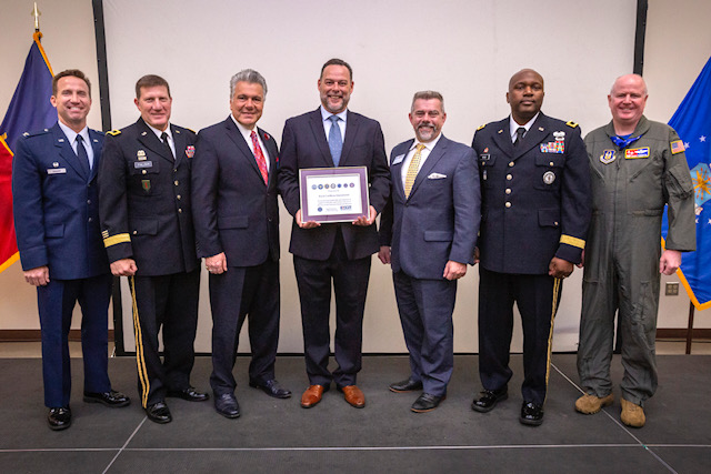 Miguel Palmero, center, Executive Officer, Royal Caribbean International, holds the Employer Support of the Guard and Reserve (ESGR) Seven Seals Award presented to Royal Caribbean International during a ceremony at the Joint Military and Family Assistance Center in Bordentown, N.J., May 17, 2019. Also pictured are, left to right, Col. John M. Cosgrove, Commander, 108th Wing, New Jersey Air National Guard; Maj. Gen. Mark W. Palzer, Commanding General, 99th Readiness Division, Army Reserve; Don Tretola, State Chair, New Jersey Employer Support of the Guard and Reserve; Bruce Townsend, Chief, Employer Outreach, ESGR; Brig. Gen. Jemal J. Beale, The Adjutant General of New Jersey, and Col. Thomas O. Pemberton, Commander, 514th Air Mobility Wing, Air Force Reserve Command. ESGR develops and promotes a supportive work environments for Guard and Reserve service members through outreach, recognition, and educational opportunities that increase awareness of applicable laws, as well as resolves employer conflicts between service members and their employers. (New Jersey National Guard photo by Mark C. Olsen)