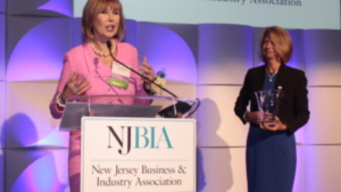 Linda Bowsden speaking with NJBIA President and CEO Michele Siekerka standing near by