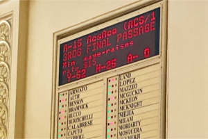Assembly voting board showing passage of $15 minimum wage bill